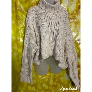 Turtleneck Belly sweater.